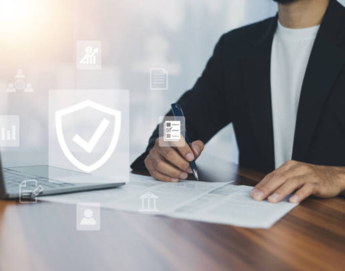 Man using  computer buy insurance online at home